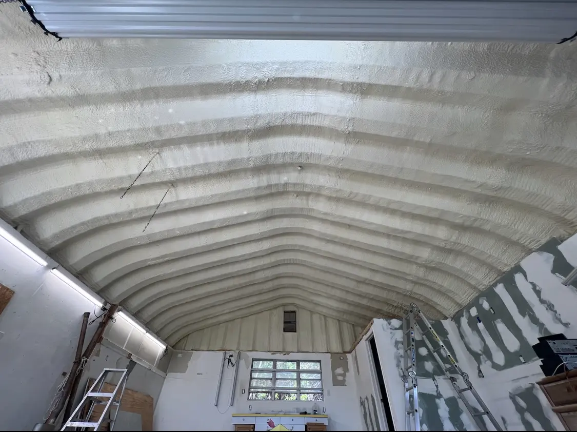 Spray polyurethane foam applied to the underside of a metal roof deck in Half Moon